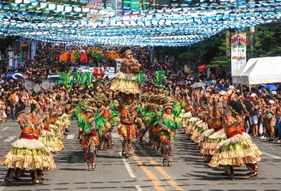 The Grand Sinulog parade taking place along the highways of Cebu City.