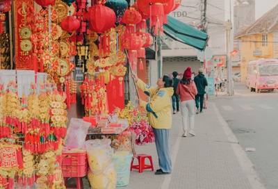 A photo of a woman readying her items for the Vietnames New Year.